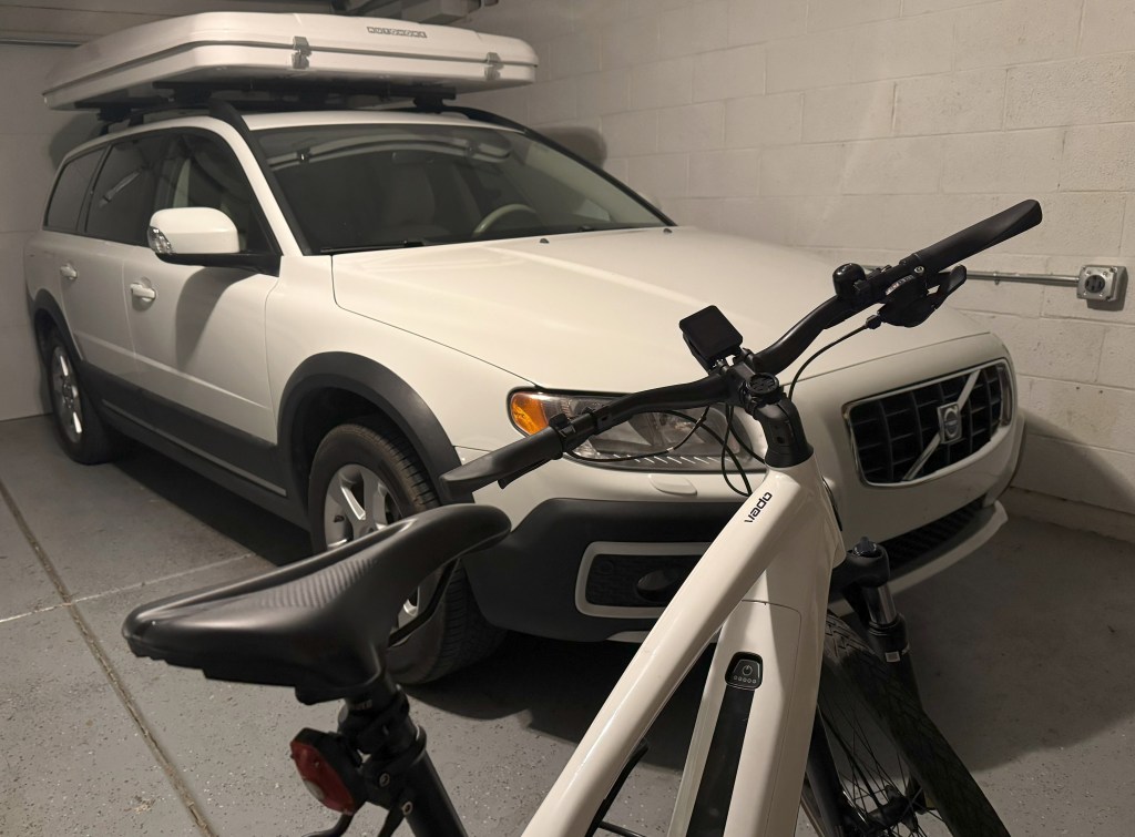 An eBike sits in front of a car