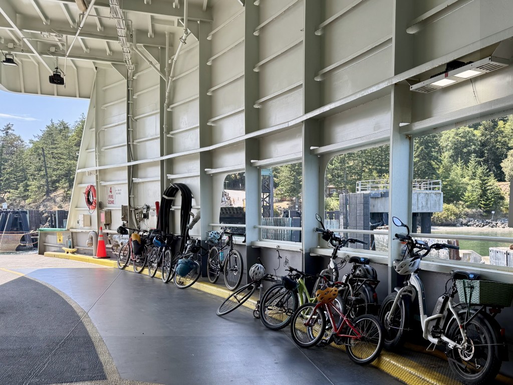 Bicycles lean against the wall of the ferry.