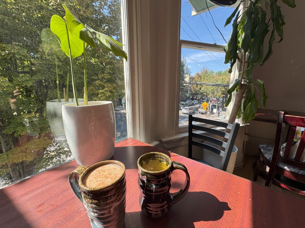 Tea sits on a table overlooking the street below.