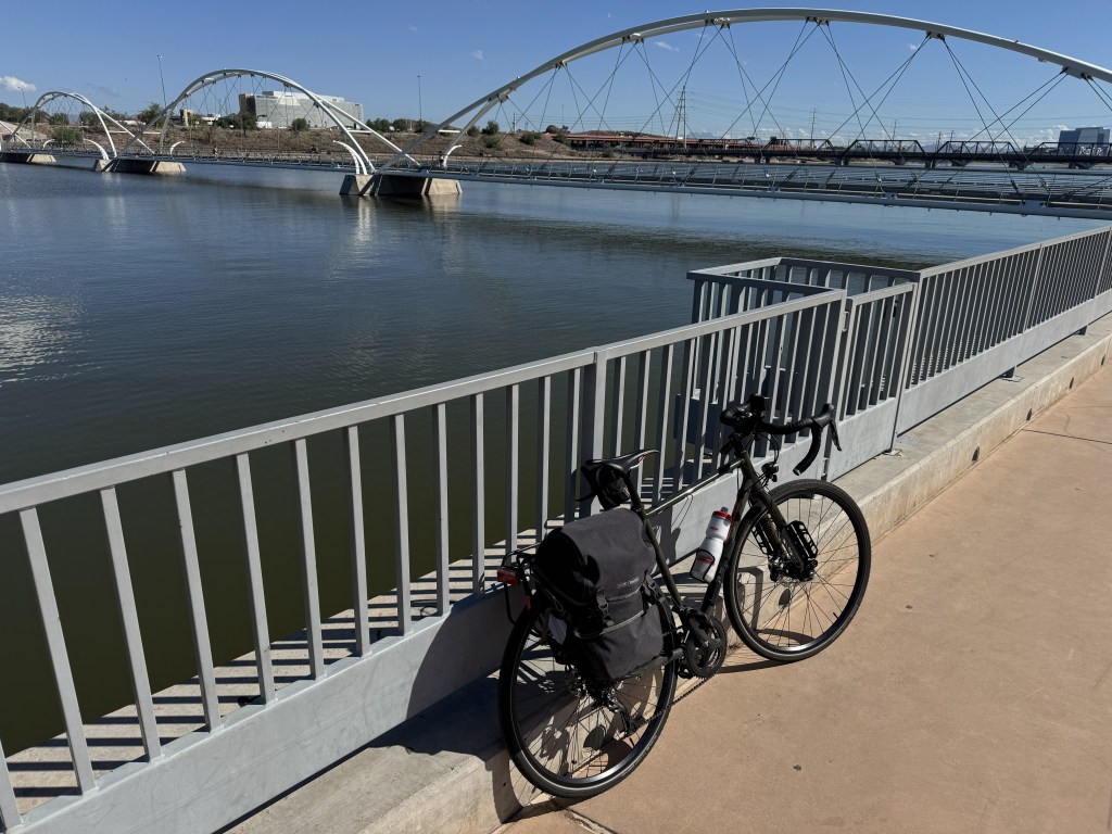 A bicycle leans against a fence at Tempe Town Lake