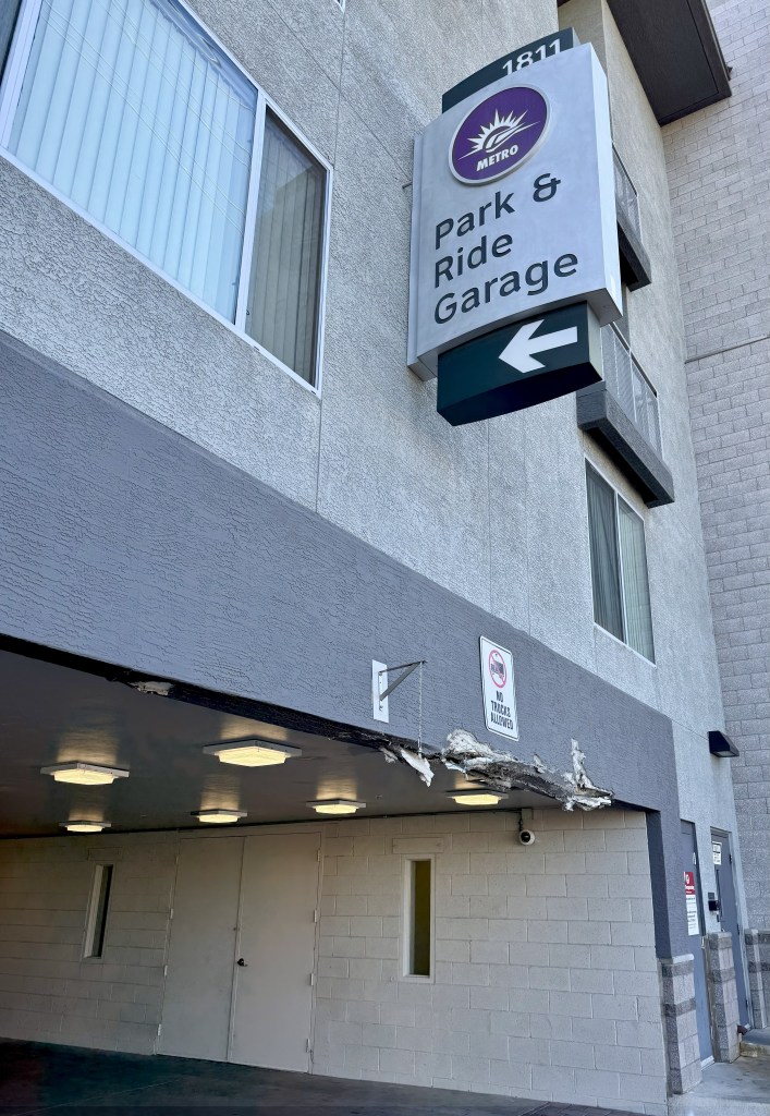 A garage entry damaged by an oversized truck