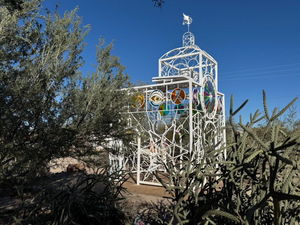 An art installation shaped like a church made of bicycle parts.