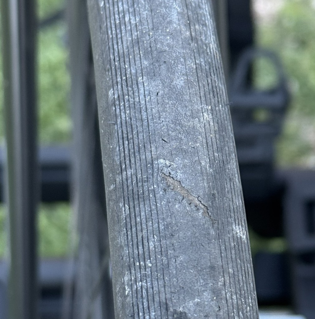 A bicycle tire with a questionable tear.