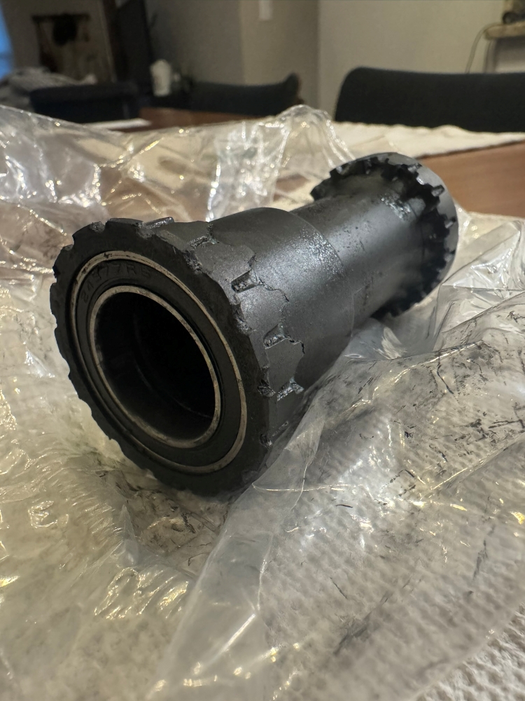 A bottom bracket removed from bicycle on a table