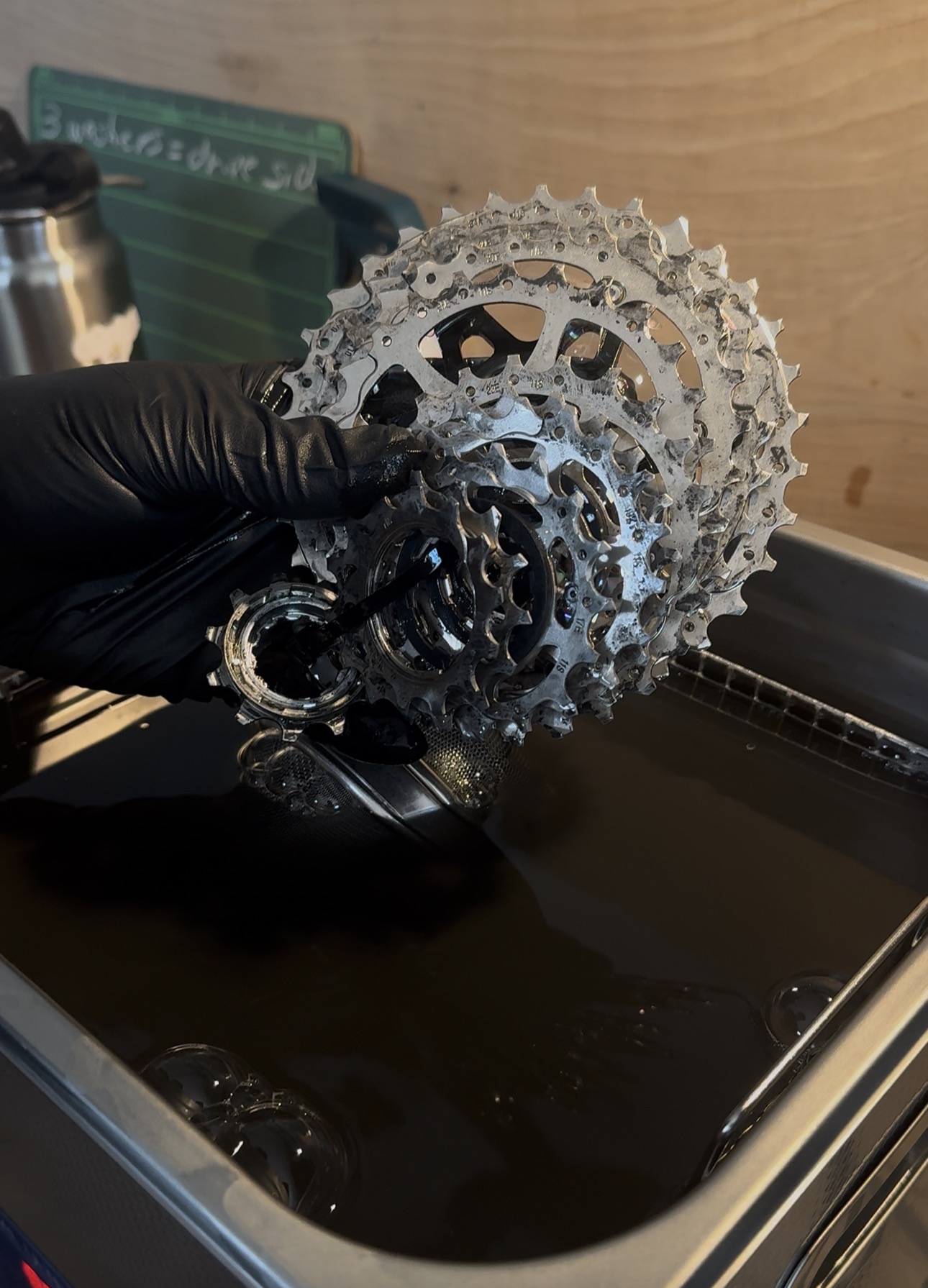 Clean gears are demonstrated being removed from an ultrasonic cleaner