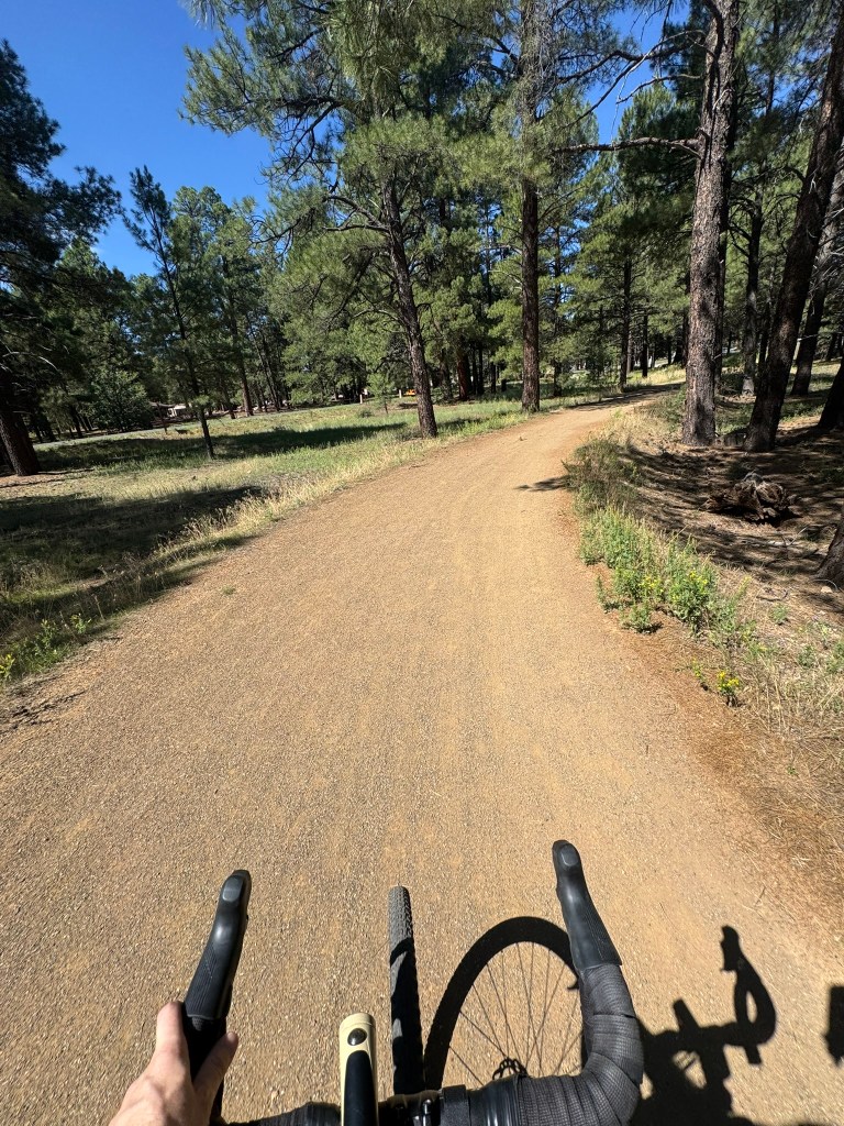 Riding along a gravel path from a first person POV